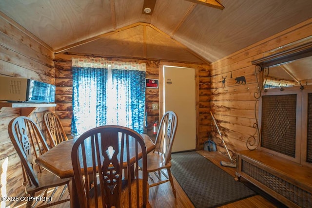 17751 Arcturus Loop, Ninilchik, AK 99639 - dining area with wooden walls, vaulted ceiling, and wood finished floors