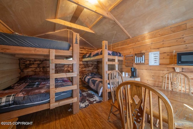 17751 Arcturus Loop, Ninilchik, AK 99639 - bedroom featuring wooden walls, vaulted ceiling, and wood finished floors