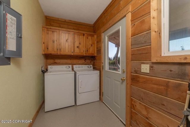 17751 Arcturus Loop, Ninilchik, AK 99639 - laundry room with electric panel, washer and dryer, cabinet space, and wood walls