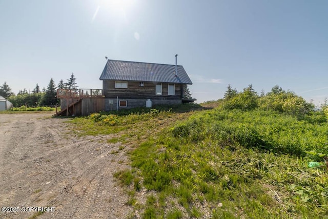 17751 Arcturus Loop, Ninilchik, AK 99639 - view of front of property with stairway, a deck, and a metal roof