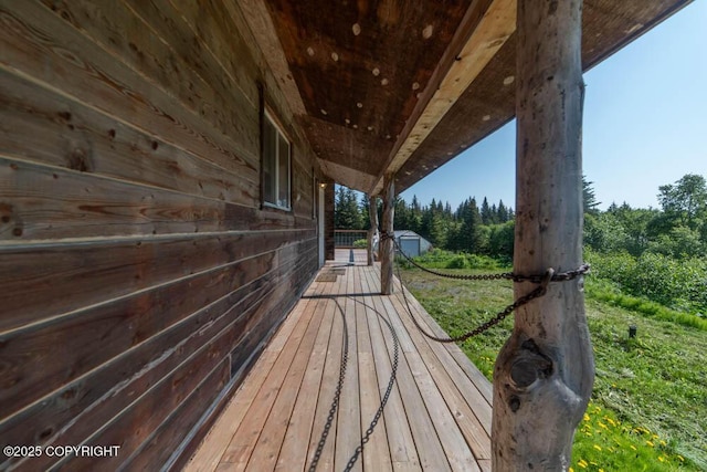 17751 Arcturus Loop, Ninilchik, AK 99639 - wooden terrace featuring a wooded view and an outbuilding