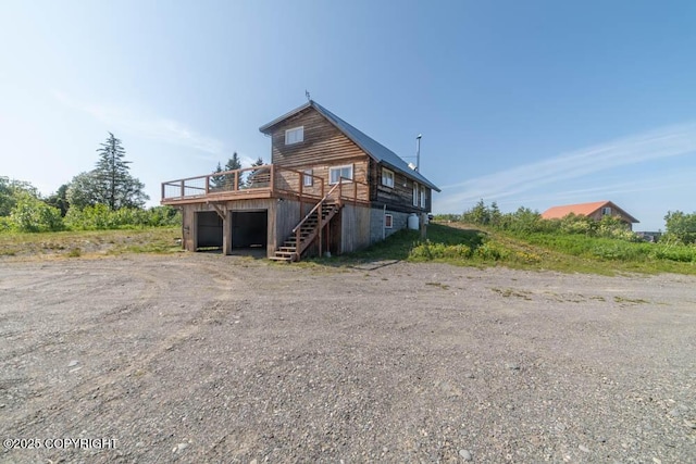 17751 Arcturus Loop, Ninilchik, AK 99639 - rear view of house with a wooden deck and stairs