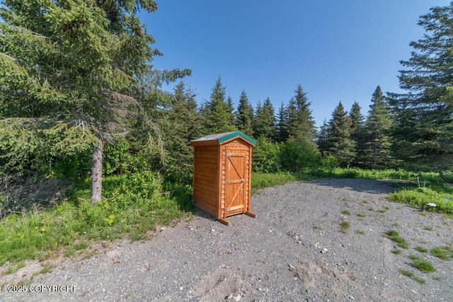 17751 Arcturus Loop, Ninilchik, AK 99639 - view of shed featuring a forest view