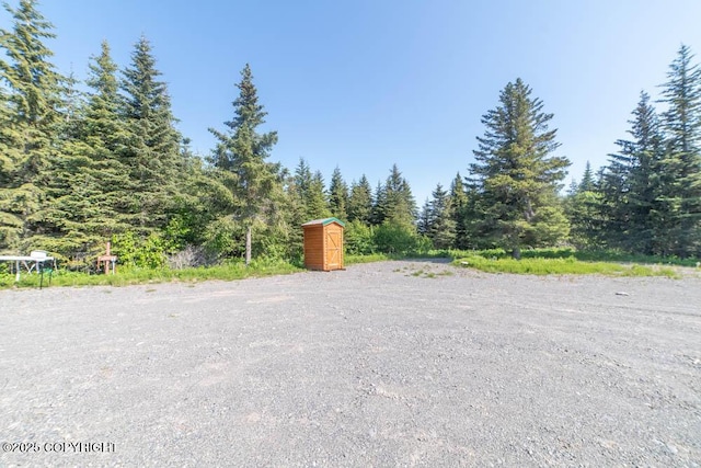17751 Arcturus Loop, Ninilchik, AK 99639 - view of dirt / gravel road featuring a wooded view