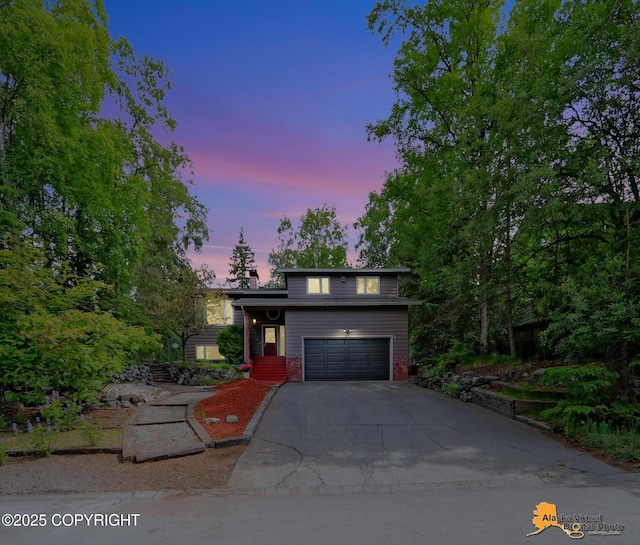 4023 Apollo Dr, Anchorage, AK 99504 - view of front of house featuring asphalt driveway and an attached garage
