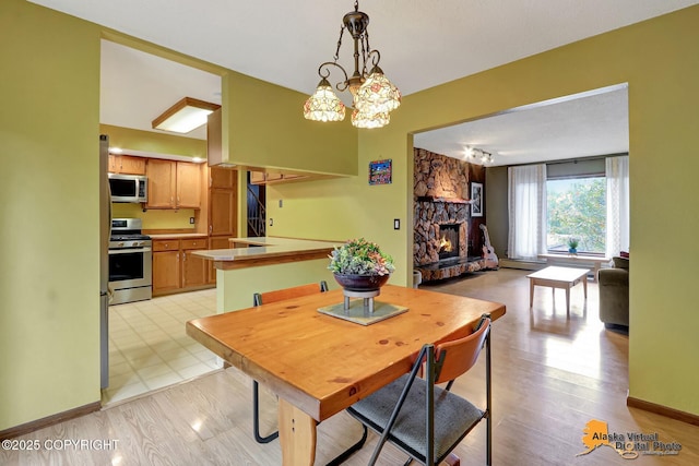 4023 Apollo Dr, Anchorage, AK 99504 - dining area featuring a stone fireplace