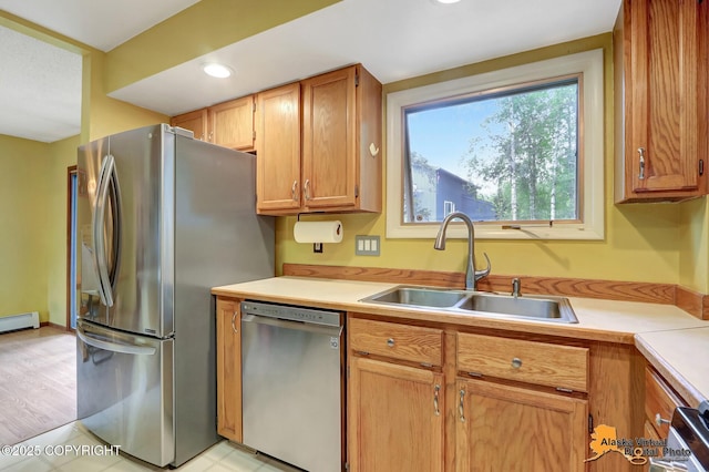 4023 Apollo Dr, Anchorage, AK 99504 - kitchen with stainless steel appliances, light countertops, baseboard heating, and recessed lighting