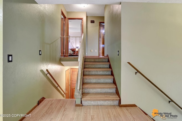 4023 Apollo Dr, Anchorage, AK 99504 - stairs with wood finished floors and baseboards
