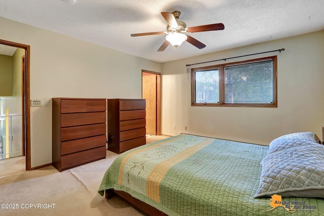 4023 Apollo Dr, Anchorage, AK 99504 - bedroom with light colored carpet, ceiling fan, and a textured ceiling
