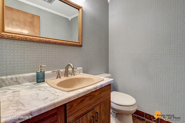 4023 Apollo Dr, Anchorage, AK 99504 - half bathroom featuring vanity and ornamental molding
