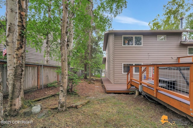 4023 Apollo Dr, Anchorage, AK 99504 - rear view of property with a fenced backyard and a deck