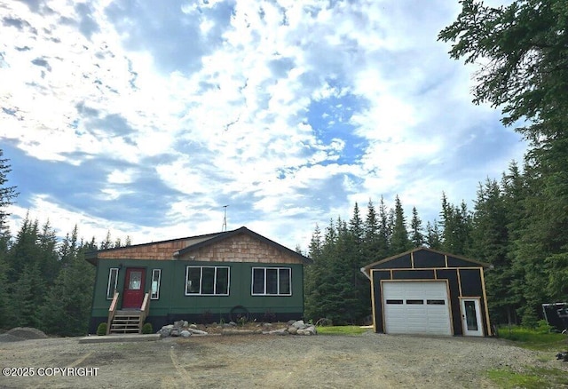5705 Felix Cir, Homer, AK 99603 - view of front of property featuring a garage, an outbuilding, and dirt driveway