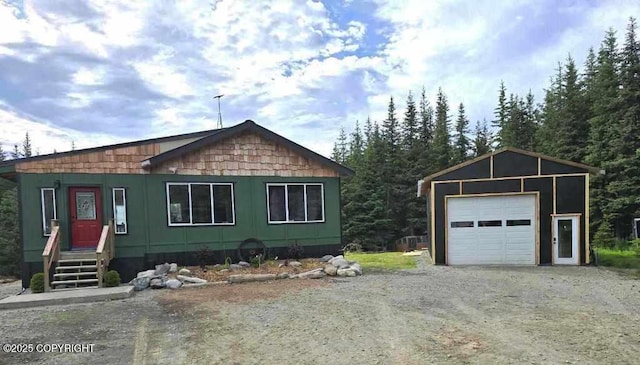 5705 Felix Cir, Homer, AK 99603 - view of front of home featuring a detached garage, driveway, and an outdoor structure