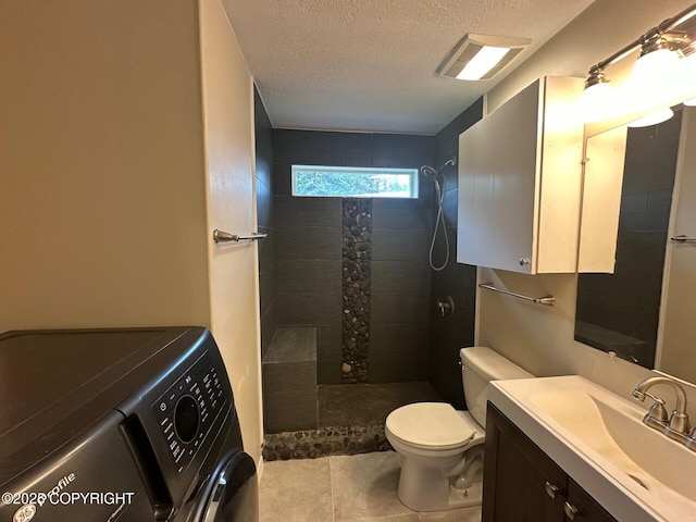 5705 Felix Cir, Homer, AK 99603 - full bathroom with washer / clothes dryer, a textured ceiling, walk in shower, vanity, and tile patterned floors