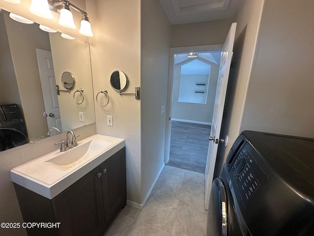 5705 Felix Cir, Homer, AK 99603 - bathroom featuring vanity, washer / clothes dryer, and tile patterned flooring
