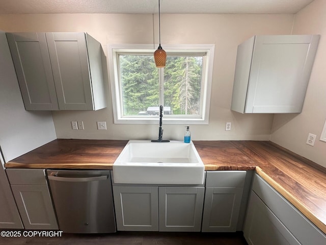 5705 Felix Cir, Homer, AK 99603 - kitchen featuring dishwasher, wooden counters, gray cabinets, and hanging light fixtures