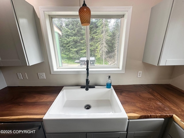 5705 Felix Cir, Homer, AK 99603 - kitchen view of dark countertops and gray cabinetry