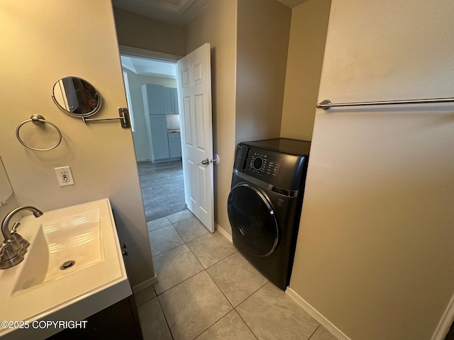 5705 Felix Cir, Homer, AK 99603 - laundry room featuring washer / dryer and light tile patterned floors