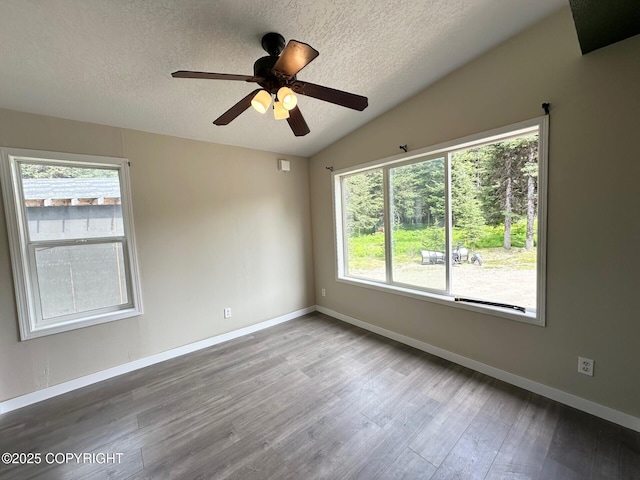 5705 Felix Cir, Homer, AK 99603 - unfurnished room with a textured ceiling, wood finished floors, vaulted ceiling, and a ceiling fan