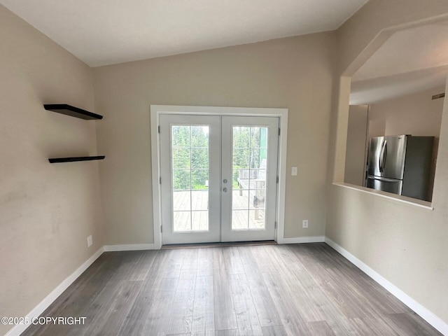 5705 Felix Cir, Homer, AK 99603 - doorway to outside with french doors, wood finished floors, and lofted ceiling