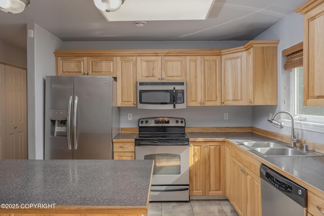 1250 Toolik Dr, North Pole, AK 99705 - kitchen featuring appliances with stainless steel finishes, light brown cabinetry, and light tile patterned flooring