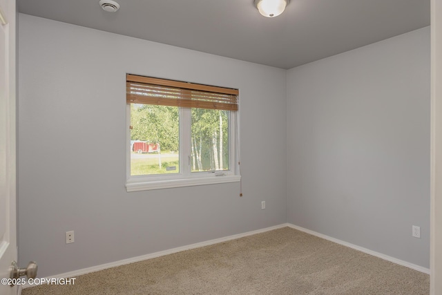 1250 Toolik Dr, North Pole, AK 99705 - spare room featuring carpet flooring and a smoke detector