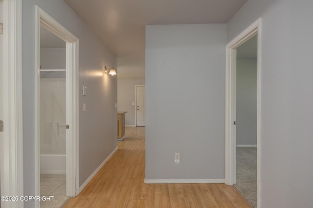 1250 Toolik Dr, North Pole, AK 99705 - corridor with light wood-style flooring and baseboards
