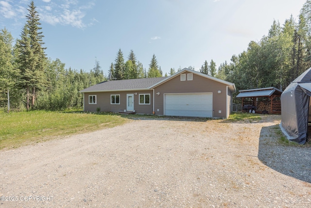 1250 Toolik Dr, North Pole, AK 99705 - ranch-style home featuring driveway and an attached garage