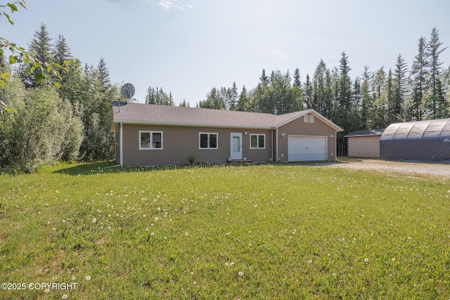 1250 Toolik Dr, North Pole, AK 99705 - ranch-style house featuring an attached garage, a front lawn, and driveway