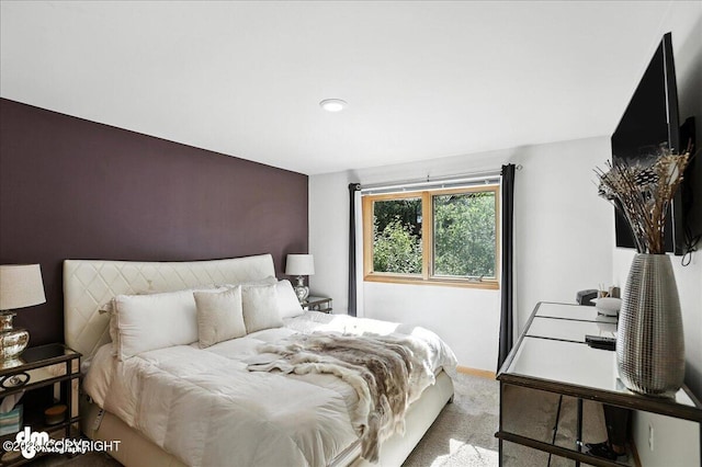 6712 Lunar Dr # K2, Anchorage, AK 99504 - carpeted bedroom featuring an accent wall and baseboards