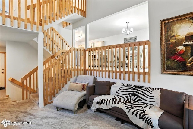 6712 Lunar Dr # K2, Anchorage, AK 99504 - living area featuring a chandelier, carpet, and a towering ceiling