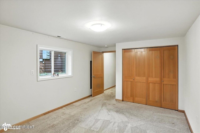 6712 Lunar Dr # K2, Anchorage, AK 99504 - unfurnished bedroom with light colored carpet and a closet