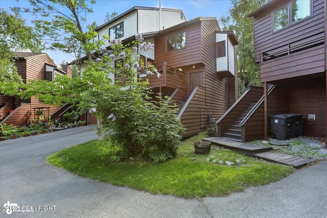 6712 Lunar Dr # K2, Anchorage, AK 99504 - view of side of home featuring stairs