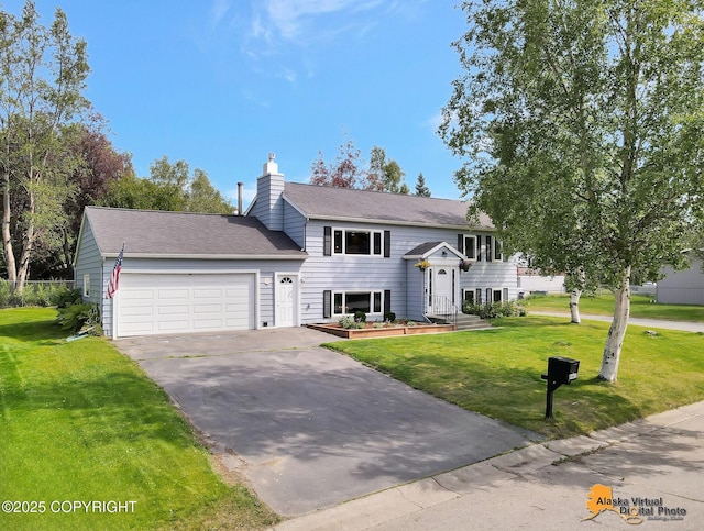 8461 Greenhill Way, Anchorage, AK 99502 - split foyer home featuring a garage, asphalt driveway, a front yard, and a chimney