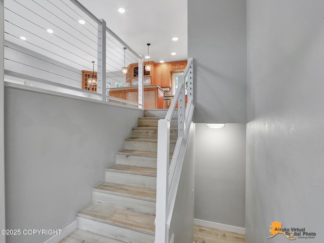 8461 Greenhill Way, Anchorage, AK 99502 - staircase with baseboards and recessed lighting