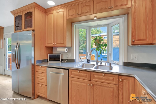 8461 Greenhill Way, Anchorage, AK 99502 - kitchen featuring stainless steel appliances, plenty of natural light, glass insert cabinets, and light wood-type flooring
