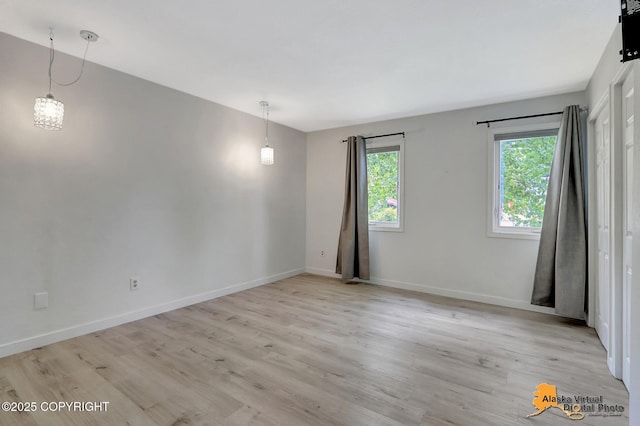 8461 Greenhill Way, Anchorage, AK 99502 - unfurnished room featuring baseboards and light wood-type flooring