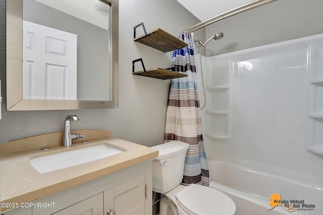 8461 Greenhill Way, Anchorage, AK 99502 - bathroom with vanity, shower / bath combo with shower curtain, and a textured wall
