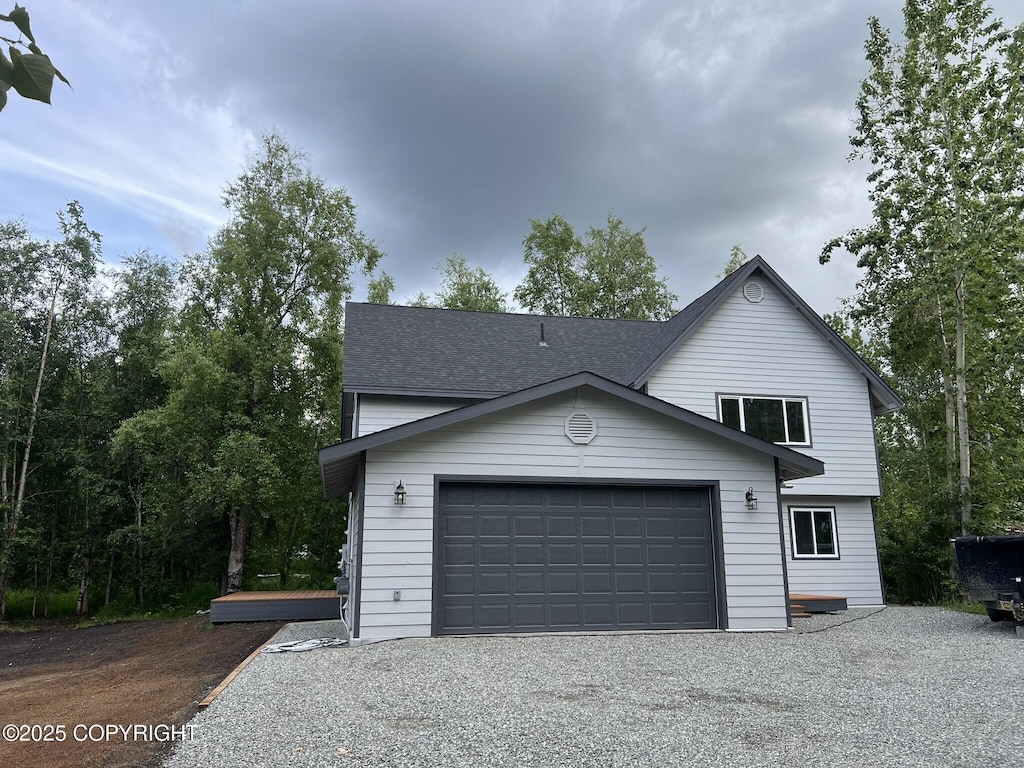 3271 N Bald Eagle Dr, Wasilla, AK 99654 - view of front facade featuring driveway and roof with shingles