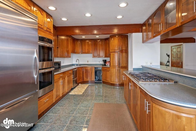 2107 Sorbus Way, Anchorage, AK 99508 - kitchen featuring stainless steel appliances, brown cabinets, glass insert cabinets, and recessed lighting