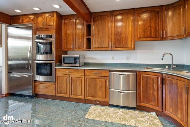 2107 Sorbus Way, Anchorage, AK 99508 - kitchen featuring appliances with stainless steel finishes, brown cabinetry, and recessed lighting