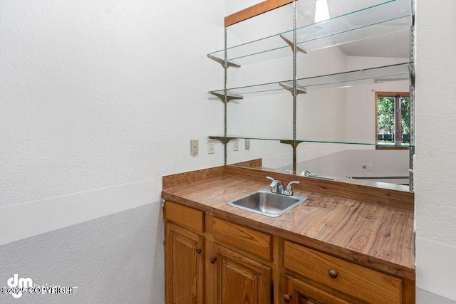 2107 Sorbus Way, Anchorage, AK 99508 - indoor wet bar with a textured wall