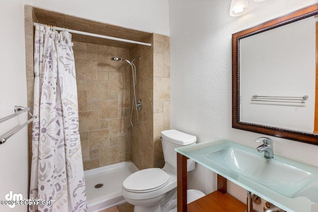 2107 Sorbus Way, Anchorage, AK 99508 - full bathroom with a tile shower and a textured wall