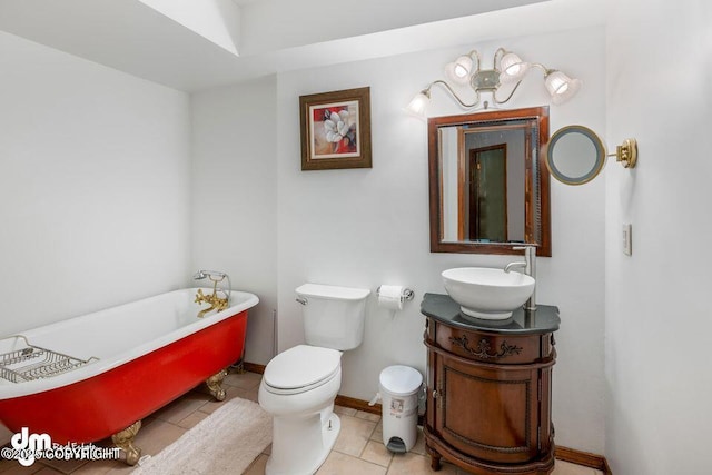 2107 Sorbus Way, Anchorage, AK 99508 - bathroom featuring a freestanding bath, vanity, and tile patterned flooring
