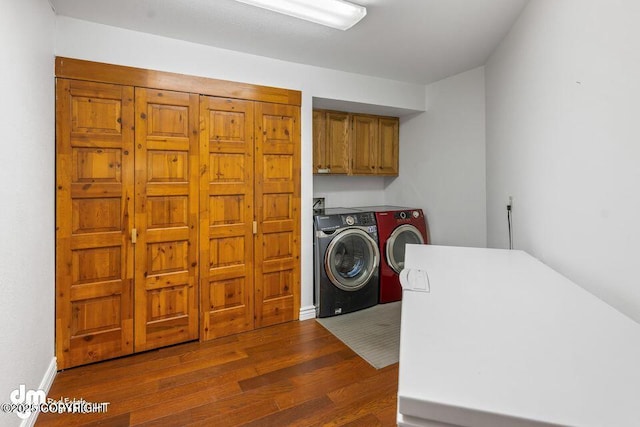 2107 Sorbus Way, Anchorage, AK 99508 - laundry area featuring cabinet space, washer and clothes dryer, and wood finished floors