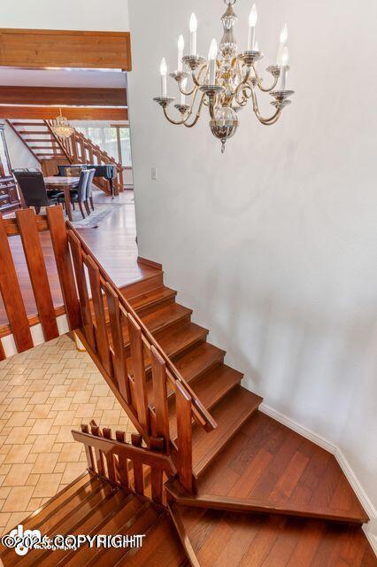 2107 Sorbus Way, Anchorage, AK 99508 - stairway with a chandelier and wood finished floors