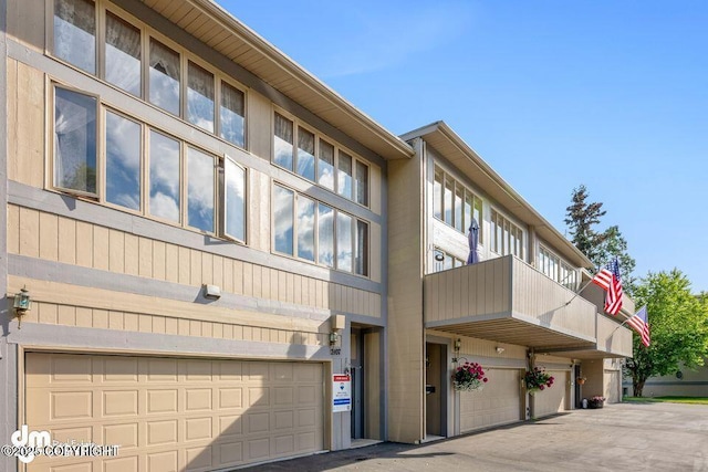 2107 Sorbus Way, Anchorage, AK 99508 - view of property featuring an attached garage and driveway