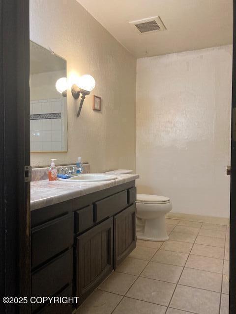 2531 W 79th Ave, Anchorage, AK 99502 - bathroom with vanity and tile patterned flooring