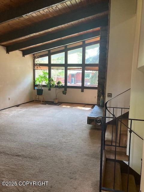 2531 W 79th Ave, Anchorage, AK 99502 - unfurnished room with a wooden ceiling with exposed beams and carpet flooring