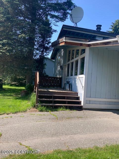 2531 W 79th Ave, Anchorage, AK 99502 - view of side of home featuring a wooden deck